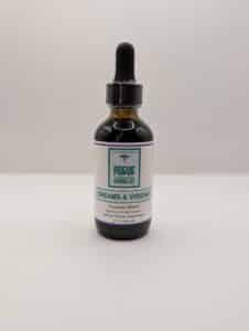 Glass bottle of Rogue Herbalist Dreams & Visions Tincture 2oz with dropper, featuring mugwort, blue lotus, damiana, lavender, and blue vervain.